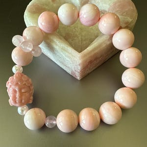 May include: A set of three ceramic mugs with a speckled, matte finish. The mugs are in shades of cream, light gray, and dark gray. Each mug has a simple, minimalist design, perfect for coffee or tea.