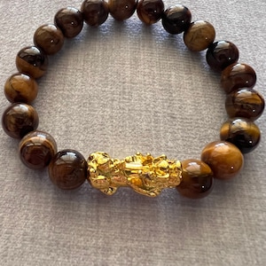 Natural Tiger&#39;s Eye Gemstone Beads 12mm w/ lucky Feng Shui 24K Gold Plated Pixiu or Pi Yao Bracelet.