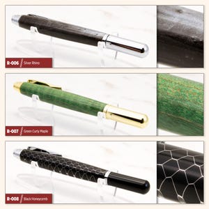 May include: Three different wooden pens with different finishes. The first pen is black with a silver finish, the second pen is green with a gold finish, and the third pen is black with a honeycomb pattern and a black finish. The pens are labeled with their corresponding product codes: R-006, R-007, and R-008.