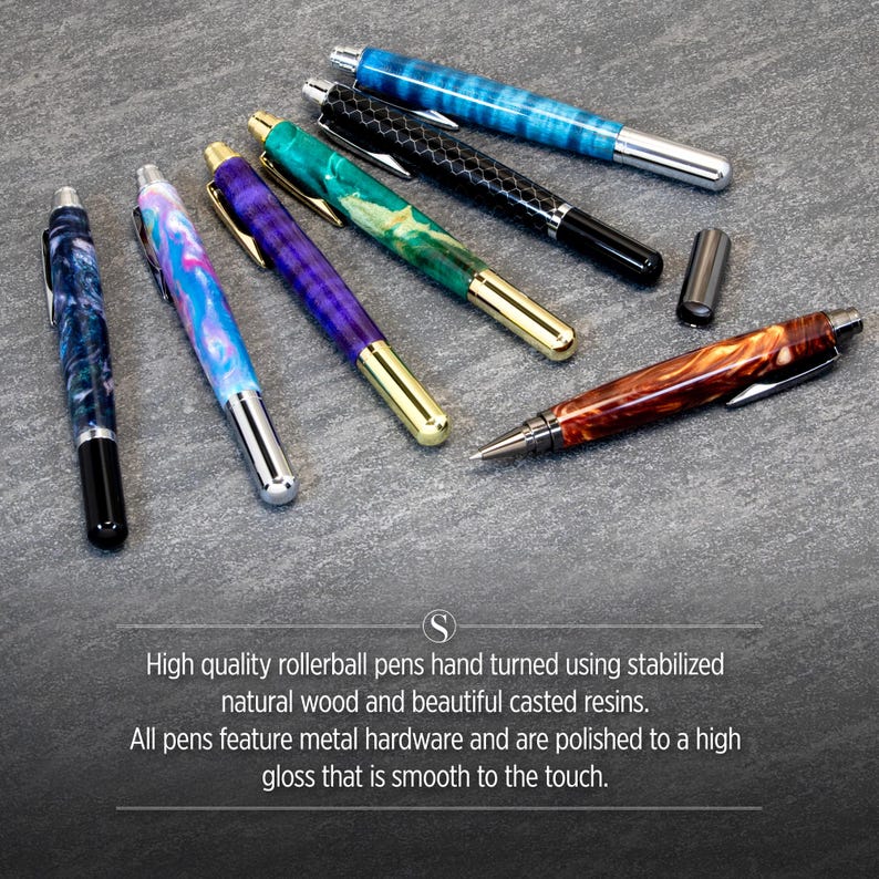 May include: A collection of eight high-quality rollerball pens with unique wood and resin designs. The pens feature metal hardware and a polished finish.
