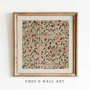 May include: Framed wall art featuring a detailed floral pattern in red, blue, and green on a tan background. The artwork is enclosed in a gold-colored wooden frame. The text "EMRE'S WALL ART" is printed at the bottom of the frame.