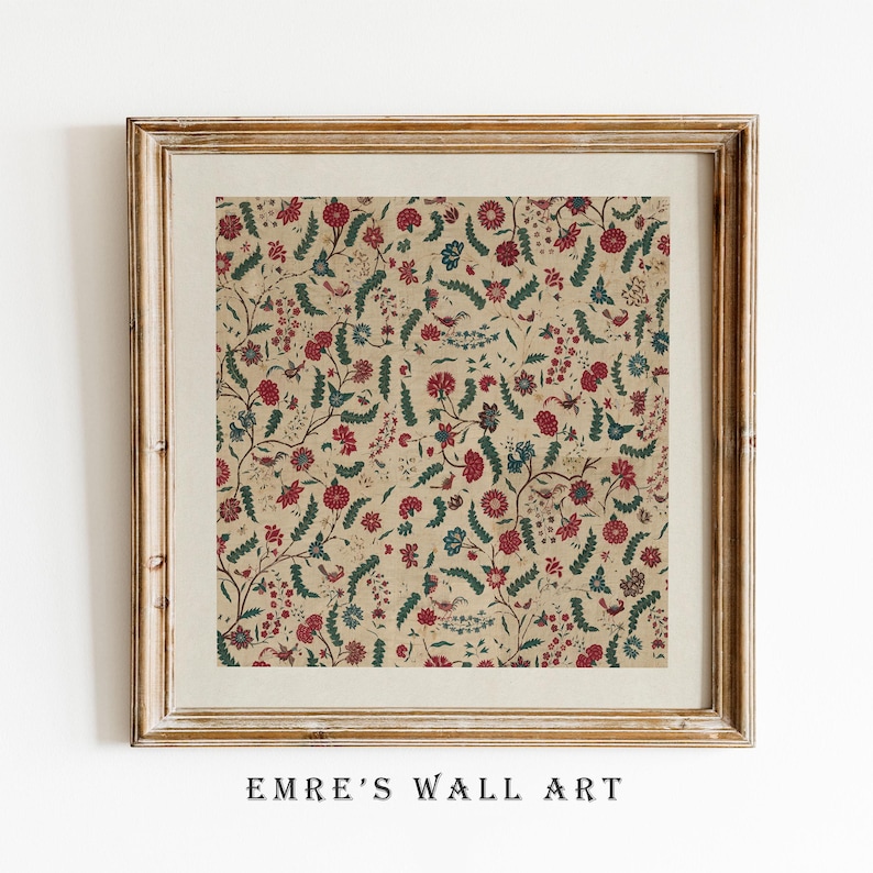May include: Framed wall art featuring a detailed floral pattern in red, blue, and green on a tan background. The artwork is enclosed in a gold-colored wooden frame. The text "EMRE'S WALL ART" is printed at the bottom of the frame.