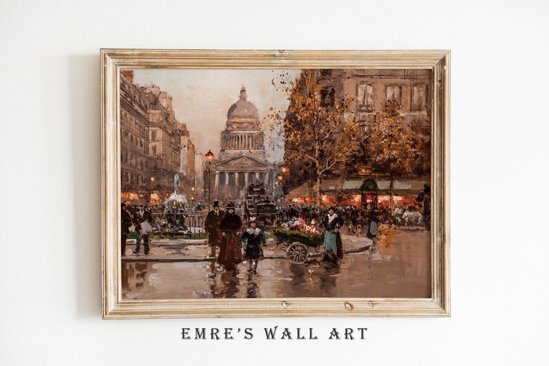 May include: A framed vintage-style print of a European city scene. The artwork depicts a bustling street with people, buildings, and a large domed structure in the background. The color palette is dominated by warm browns and golds, with the text "EMRE'S WALL ART" at the bottom.