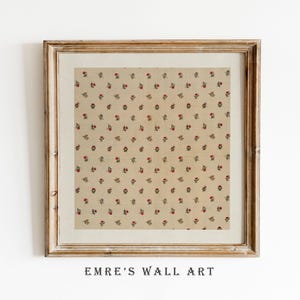 May include: Framed wall art featuring a repeating pattern of small red flowers with green leaves on a beige background. The artwork is in a wooden frame with a white mat. The text "EMRE'S WALL ART" is printed at the bottom.
