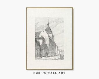 May include: A framed black and white architectural print. The print depicts a detailed street scene with a tall building featuring a steeple. The artwork is in a gold frame and has the text "EMRE'S WALL ART" at the bottom.