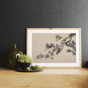A vintage Japanese ink wash painting of a pine tree branch with detailed pine needles and a small pinecone against a textured beige paper background. The elegant black brushstrokes capture a minimalist, traditional East Asian artistic look. A small red artist seal is visible in the bottom right corner.