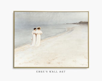 May include: A framed landscape painting depicting two figures in long white dresses standing on a sandy beach by the water. One figure wears a wide-brimmed hat. The scene is rendered in muted, soft tones with a hazy horizon. Text reads EMRE'S WALL ART.