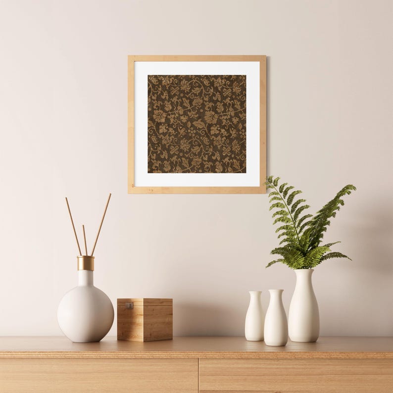 An antique-style botanical fabric art print featuring an intricate rustic textile pattern in warm brown tones. The design shows woven floral vines and leaves, arranged in an old-world tapestry style. The soft contrast between background and pattern gives a sense of depth and age. Ideal for vintage-inspired digital wall decor and home styling.