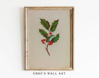 May include: A vintage illustration of a holly sprig with red berries, framed in a light wood frame. The image is on a white background.