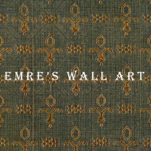 Vintage green woven textile fragment with repeating gold ornamental motifs, high-resolution fabric pattern print for wall decor, antique tapestry style.