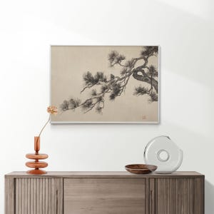 A vintage Japanese ink wash painting of a pine tree branch with detailed pine needles and a small pinecone against a textured beige paper background. The elegant black brushstrokes capture a minimalist, traditional East Asian artistic look. A small red artist seal is visible in the bottom right corner.
