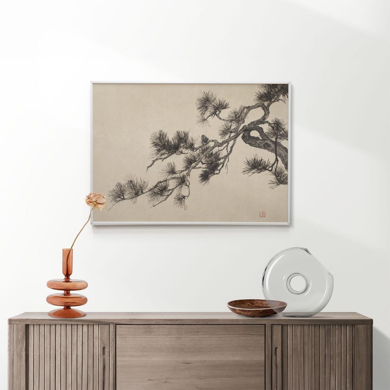 A vintage Japanese ink wash painting of a pine tree branch with detailed pine needles and a small pinecone against a textured beige paper background. The elegant black brushstrokes capture a minimalist, traditional East Asian artistic look. A small red artist seal is visible in the bottom right corner.