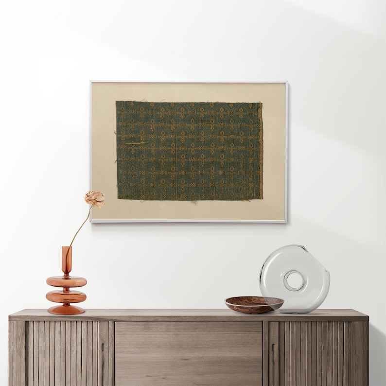 Rustic green and gold woven fabric fragment print, vintage textile motif digital art, ideal for antique tapestry wall decor and printable artwork.