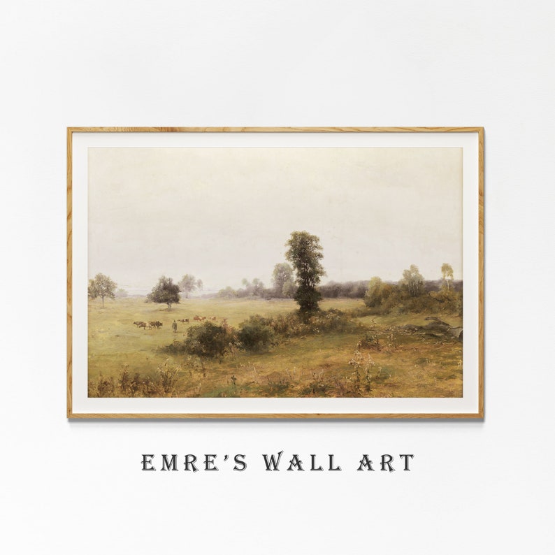 May include: A framed painting depicting a rural landscape with a group of cattle grazing in a field. The painting features a hazy sky, green trees, and a grassy field.