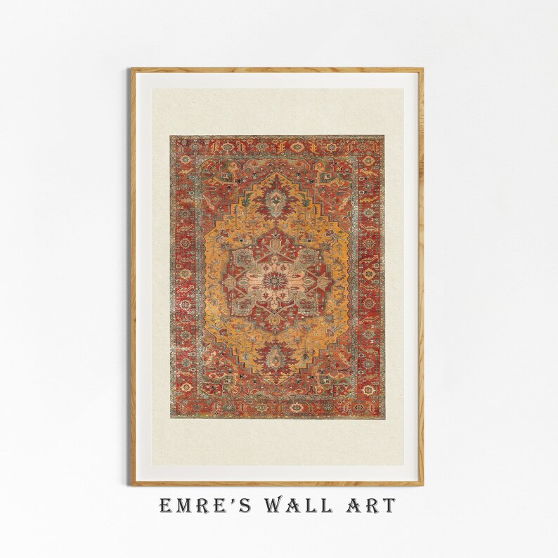 May include: A framed print of a vintage rug with a red, orange, and green geometric pattern. The rug has a central medallion with a floral design. The frame is a light wood colour.
