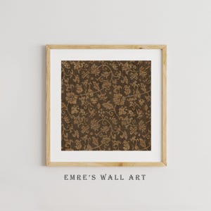 An antique-style botanical fabric art print featuring an intricate rustic textile pattern in warm brown tones. The design shows woven floral vines and leaves, arranged in an old-world tapestry style. The soft contrast between background and pattern gives a sense of depth and age. Ideal for vintage-inspired digital wall decor and home styling.