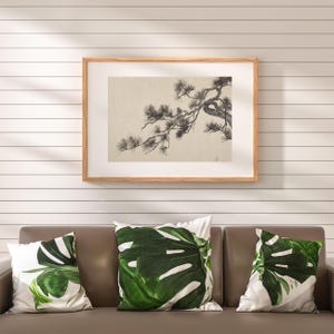 A vintage Japanese ink wash painting of a pine tree branch with detailed pine needles and a small pinecone against a textured beige paper background. The elegant black brushstrokes capture a minimalist, traditional East Asian artistic look. A small red artist seal is visible in the bottom right corner.