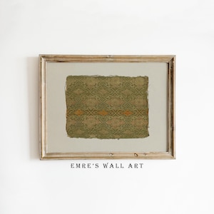 May include: Framed wall art featuring a textured, olive green and gold patterned textile. The artwork is set against a neutral background within a gold-toned wooden frame. The text "EMRE'S WALL ART" is printed at the bottom.