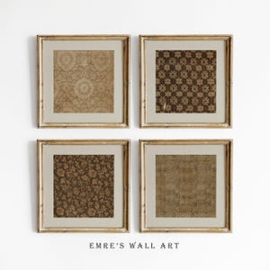 May include: Four square wall art pieces in light wood frames, each featuring a different brown and beige textile pattern. The prints display intricate floral, geometric, and damask-style motifs. The text EMRE'S WALL ART appears at the bottom.