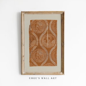 May include: Framed wall art featuring a repeating pattern of circular designs in shades of brown and white. The artwork is set against a neutral background and framed in a gold-toned wooden frame. The text "EMRE'S WALL ART" is printed at the bottom.
