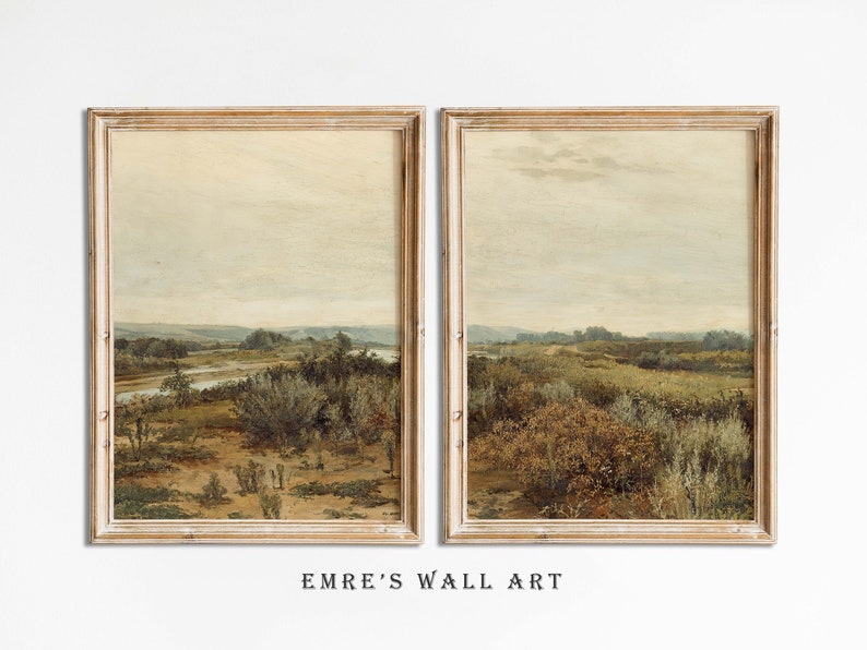 May include: A pair of framed landscape paintings with a muted color palette depicting a river winding through a field of tall grasses and trees. The paintings are in a light wood frame.