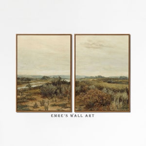 May include: A set of two framed landscape paintings depicting a rural scene with a river, trees, and a cloudy sky. The paintings are in a muted color palette of greens, browns, and blues.