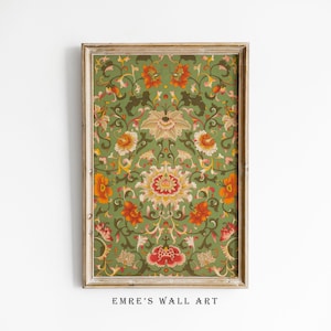 May include: A framed print of a vintage floral pattern with green, orange, red, and white flowers. The frame is a light wood color.