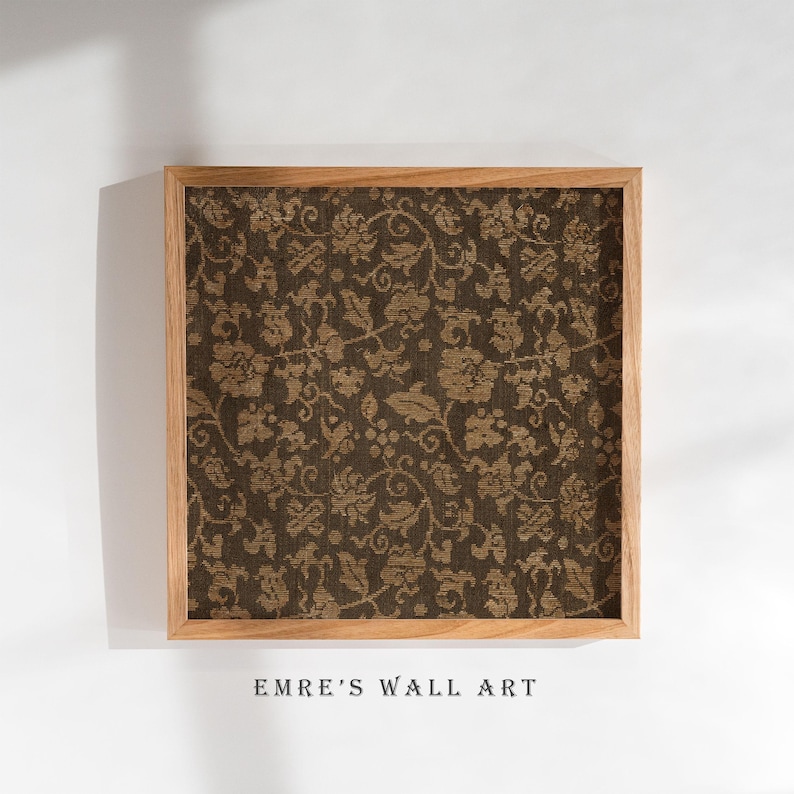An antique-style botanical fabric art print featuring an intricate rustic textile pattern in warm brown tones. The design shows woven floral vines and leaves, arranged in an old-world tapestry style. The soft contrast between background and pattern gives a sense of depth and age. Ideal for vintage-inspired digital wall decor and home styling.