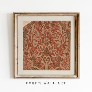 May include: Framed wall art featuring a detailed, ornate pattern in shades of red, brown, and cream. The design includes floral and paisley-like motifs. The artwork is set within a gold-toned wooden frame, with the text "EMRE'S WALL ART" at the bottom.