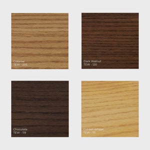 May include: Four wood samples in different shades of brown, from light to dark. The samples are labeled with their names and TEW numbers: Colonial TEW-205, Dark Walnut TEW-120, Chocolate TEW-119, and Golden Wheat TEW-111.