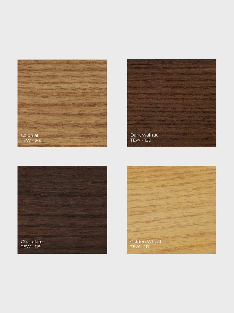 May include: Four wood samples in different shades of brown, from light to dark. The samples are labeled with their names and TEW numbers: Colonial TEW-205, Dark Walnut TEW-120, Chocolate TEW-119, and Golden Wheat TEW-111.
