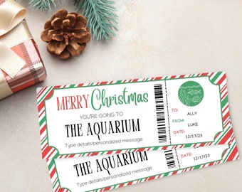 May include: Two printable Christmas gift vouchers with a red, white, and green striped background. The vouchers say "Merry Christmas, You're going to the Aquarium."  The vouchers have a space to write in the recipient's name, the giver's name, and the date.