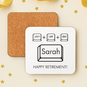 May include: Square white coaster with a keyboard-themed design. The design includes "ctrl + alt + del" keys, the name "Sarah", and the phrase "HAPPY RETIREMENT!". A separate cork coaster is visible in the background.