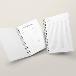 Open spiral bound wedding planner showing interior planning pages, personalised hardback wedding organiser for bride to be