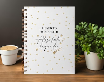 May include: A white spiral-bound notebook featuring a pattern of small gold stars and a shooting star. The text printed in the centre reads I USED TO WORK WITH Absolute legends in a combination of bold block letters and a black cursive script.