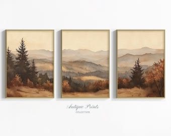 May include: Set of three framed landscape prints. Each print features a watercolor painting of a mountain range and forest in shades of brown, tan, and beige. The prints are in gold frames. The text "Antique Prints Collection" is at the bottom.