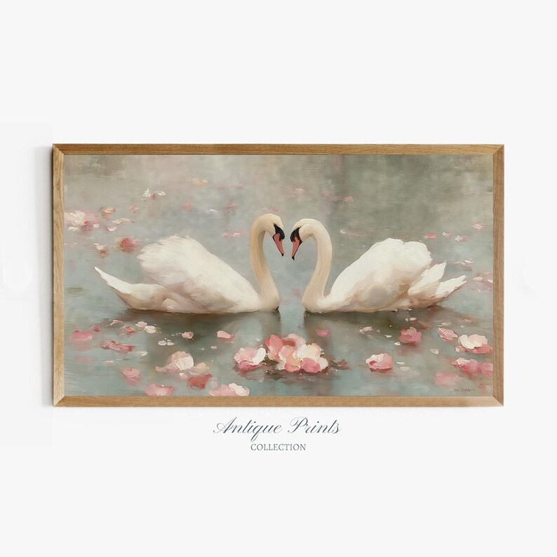 May include: A framed print featuring two white swans with curved necks forming a heart shape. The swans float on a light blue water surface with pink flower petals. The print is labeled "Antique Prints Collection."