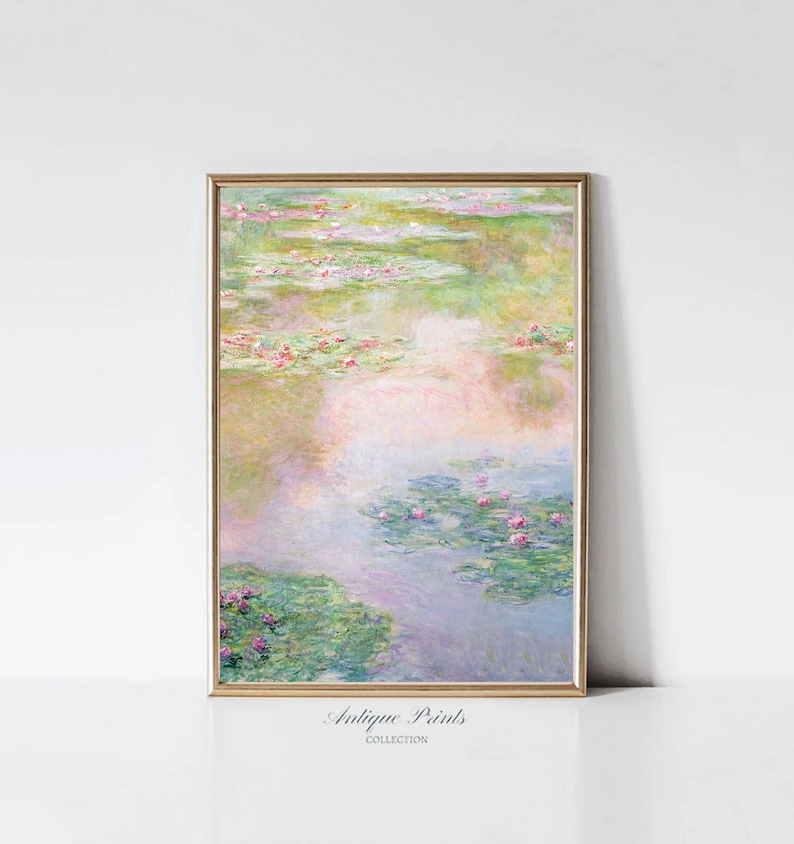 May include: A framed print of a painting depicting a pond with water lilies and pink flowers. The water is a light blue and the lilies are green. The background is a soft, pastel pink and green.