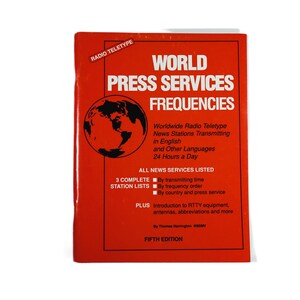 May include: A red book titled "World Press Services Frequencies" with a map of the world on the cover. The book lists worldwide radio teletype news stations transmitting in English and other languages 24 hours a day. It includes three complete station lists by transmitting time, frequency order, and country and press service. The book also includes an introduction to RTTY equipment, antennas, abbreviations, and more. This is the fifth edition.
