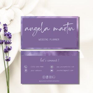 May include: Purple business card with a watercolour background. The text on the card reads "angela martin WEDDING PLANNER" and "let's connect!" with contact information including a phone number, website address, email address, and social media handle.