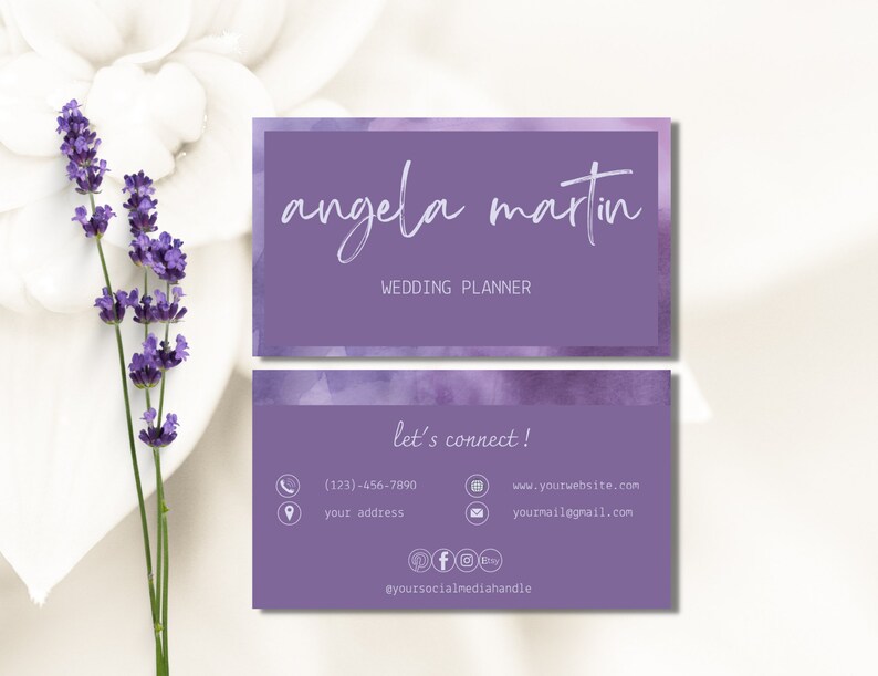 May include: Purple business card with a watercolour background. The text on the card reads "angela martin WEDDING PLANNER" and "let's connect!" with contact information including a phone number, website address, email address, and social media handle.