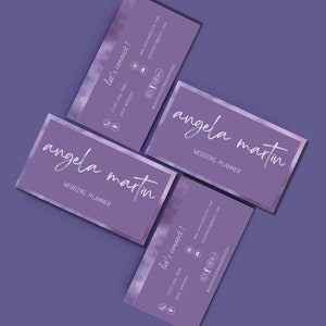 May include: Two purple business cards with a watercolour design. The text on the cards reads "angela martin" and "wedding planner". The cards also include contact information, including a website address, email address, and phone number.