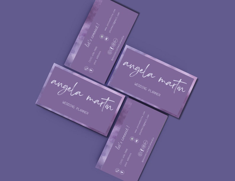 May include: Two purple business cards with a watercolour design. The text on the cards reads "angela martin" and "wedding planner". The cards also include contact information, including a website address, email address, and phone number.