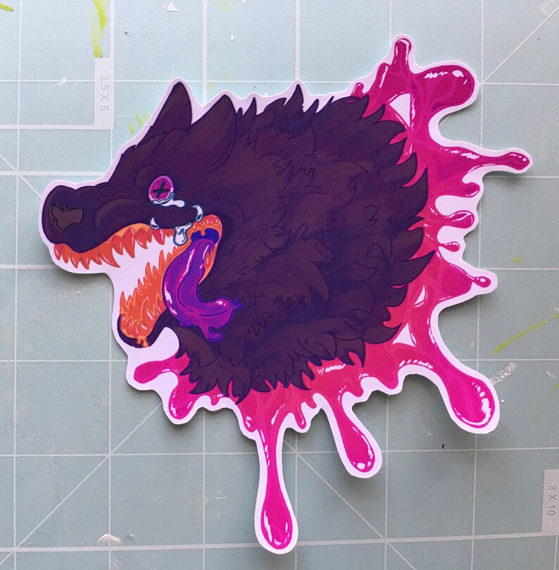 May include: A black and purple wolf with a pink tongue and fangs, with a pink splatter design behind it.