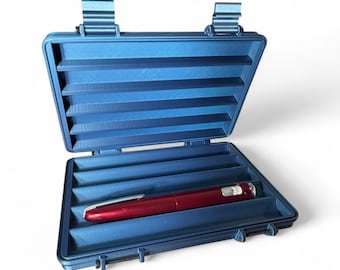 May include: Open blue case with a red pen inside. The case has a ribbed design and is open, revealing the pen in a compartment. The case has two clasps and two hinges. The pen is a deep red color.
