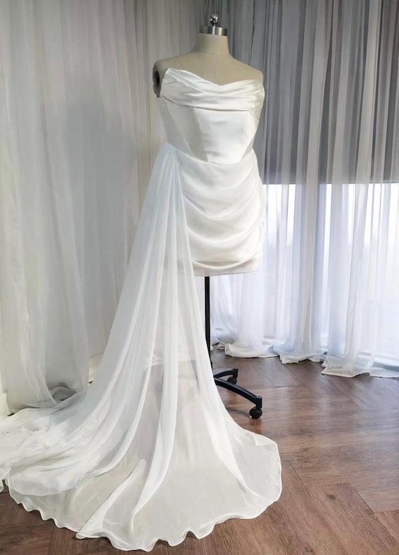 sachin and babi light blue dress This timeless 1960s chiffon and satin wedding gown is now available. Modest  and elegant for a church wedding while still keeping the clean, modern  lines of the era. Fits approximately a size