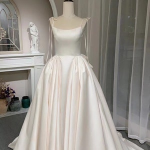 Lilibet | Satin corset custom wedding dress with bow, unique minimalist ball gown, simple modest bridal dress