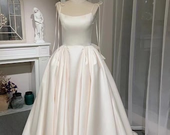 Ivory satin corset custom wedding dress with bow, unique minimalist ball gown, simple modest bridal dress