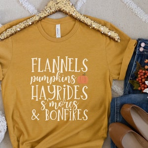 Flannels Pumpkins Hayrides S&#39;mores & Bonfires T-Shirt | Comfy Autumn Shirt | Pumpkin Fall Harvest Shirt