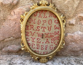 Vintage Ornate Gilded Wooden Frame with a Cross Stitch Alphabet Sampler